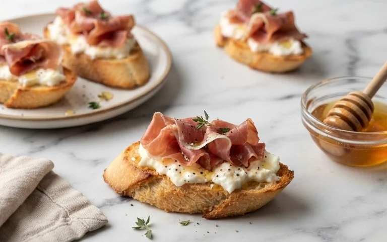 Beef Prosciutto Crostini with Burrata and Lemon Honey Drizzle